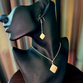 Hand carved mammoth tusk pendant with matching earrings